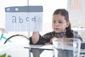 Education icon against office kid girl writing background