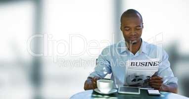 Business man having a coffee against blue and white blurred background