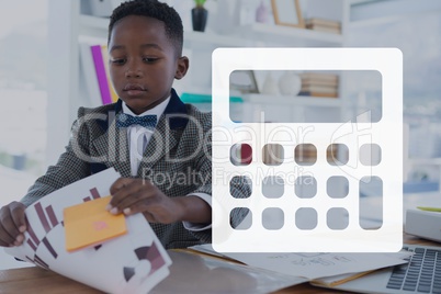 Calculator icon against office kid boy reading background