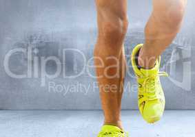 Athletic legs jogging on the spot in room