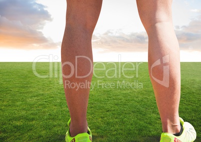 Athletic legs on grass