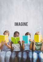 Group of children reading books in front of Imagine text