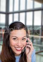 Happy customer care representative woman against building background