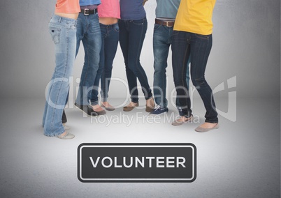 Group of students standing with Volunteer text