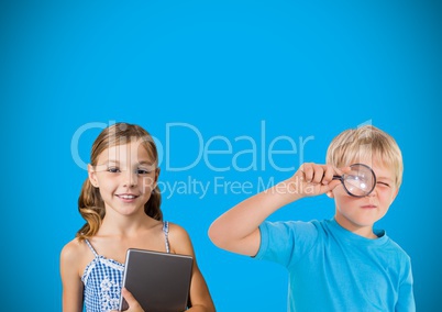 Kids with magnifying glass in front of blue background