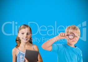 Kids with magnifying glass in front of blue background
