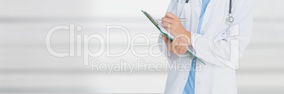 Doctor writing against grey background