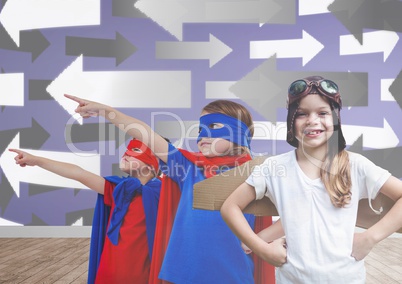 Kids in costumes in blank room with arrows