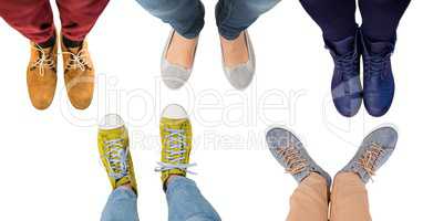 Different colored feet and shoes on blank background