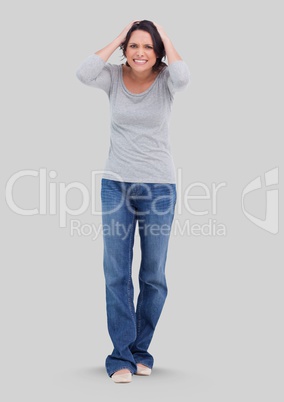 Full body portrait of stressed woman standing with grey background