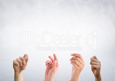 Four hands with bright background