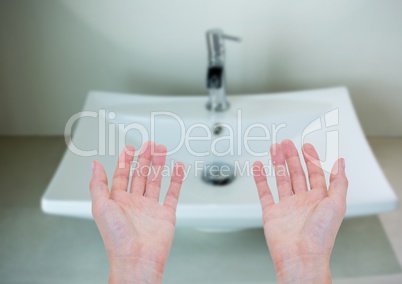 Washing hands in sink