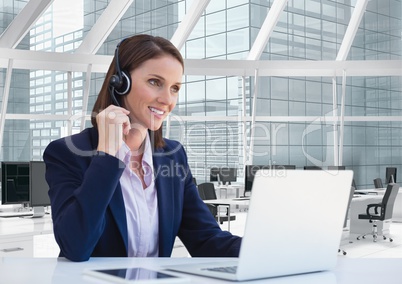 Happy customer care representative woman against office background