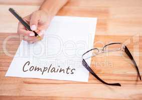 Complaints  text written on page with glasses