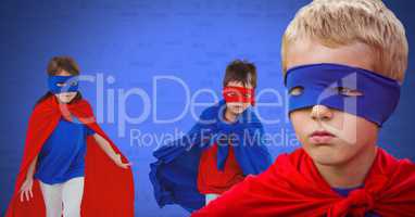 Superhero kids with blank blue background