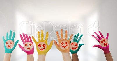 Colorful hands with faces in bright hall