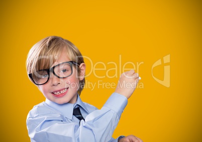 Boy writing in front of yellow blank background