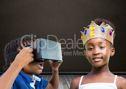 Boy with VR Headset and girl with crown in front of blackboard