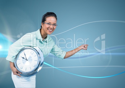 Woman holding clock in front of blue curved background