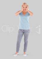 Full body portrait of stressed woman standing with grey background