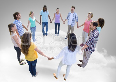 Circle of people holding hands  together on clouds