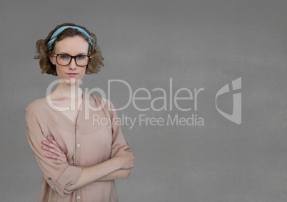 Business woman standing against grey background