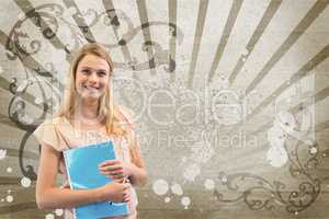 Happy young student woman holding a notebook against brown and white splattered background