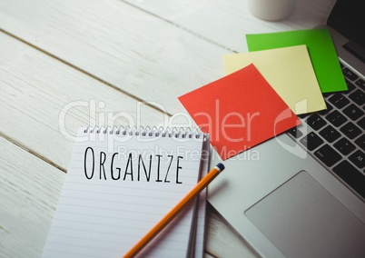 Organize  text written on page with sticky notes and laptop