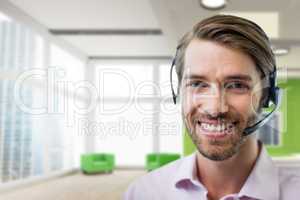 Happy customer care representative man against office background