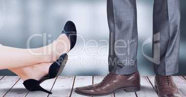 Businesswoman and businessman's feet and shoes
