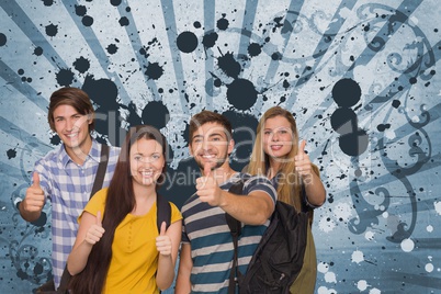 Happy young students against blue splattered background