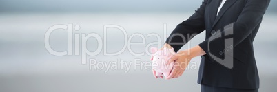 Woman holding a piggy bank