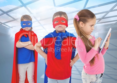 Superhero kids and girl on tablet under windows