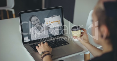 Woman using a computer with e-learning information in the screen