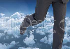Businessman's legs running in cloud sky