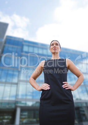 Business woman standing against building background