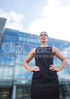 Business woman standing against building background