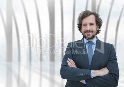 Business man standing against building background