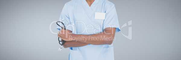 Doctor man holding a stethoscope against grey background
