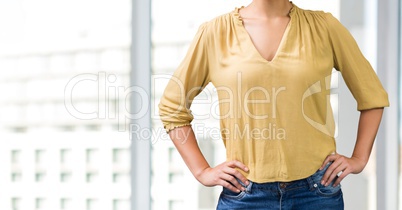 Business woman standing against white blurred background