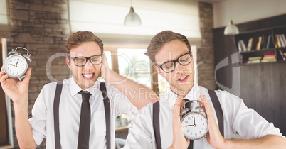 Hipster twins holding clocks in front of cafe