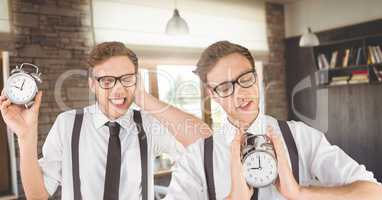 Hipster twins holding clocks in front of cafe