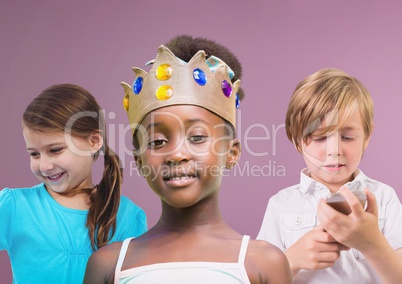 Girl wearing crown with friends in front of purple background