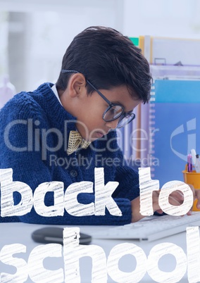 Back to school text against office kid boy writing background