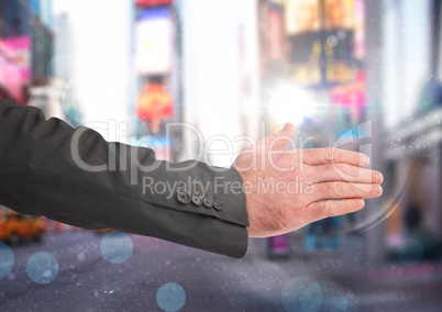 Businessman hand in city rush