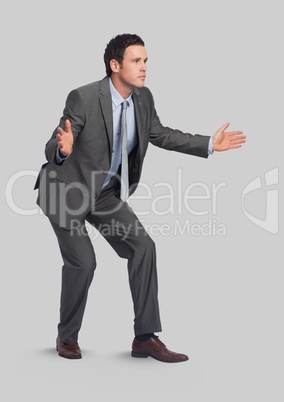 Full body portrait of man standing with grey background