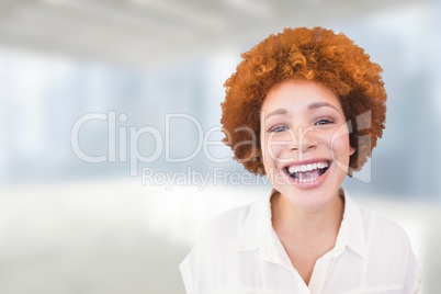 Happy business woman standing against white and blue blurred background