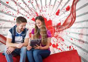 Young students looking at a tablet against white and red splattered background