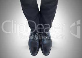 Mans legs and feet in black suit and shoes