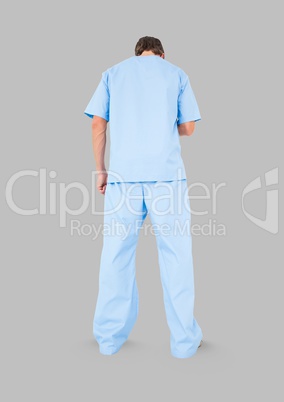 Full body portrait of medical nurse man standing with grey background